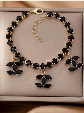 Macy's Gold Plated Bracelet with Black Stones and Floral Charms